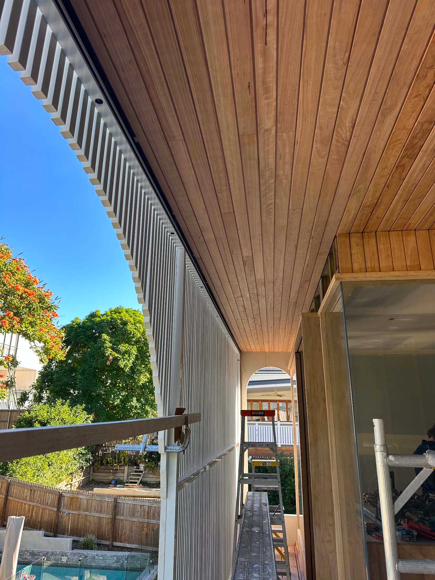 Timber-lined eaves and vertical cladding detail